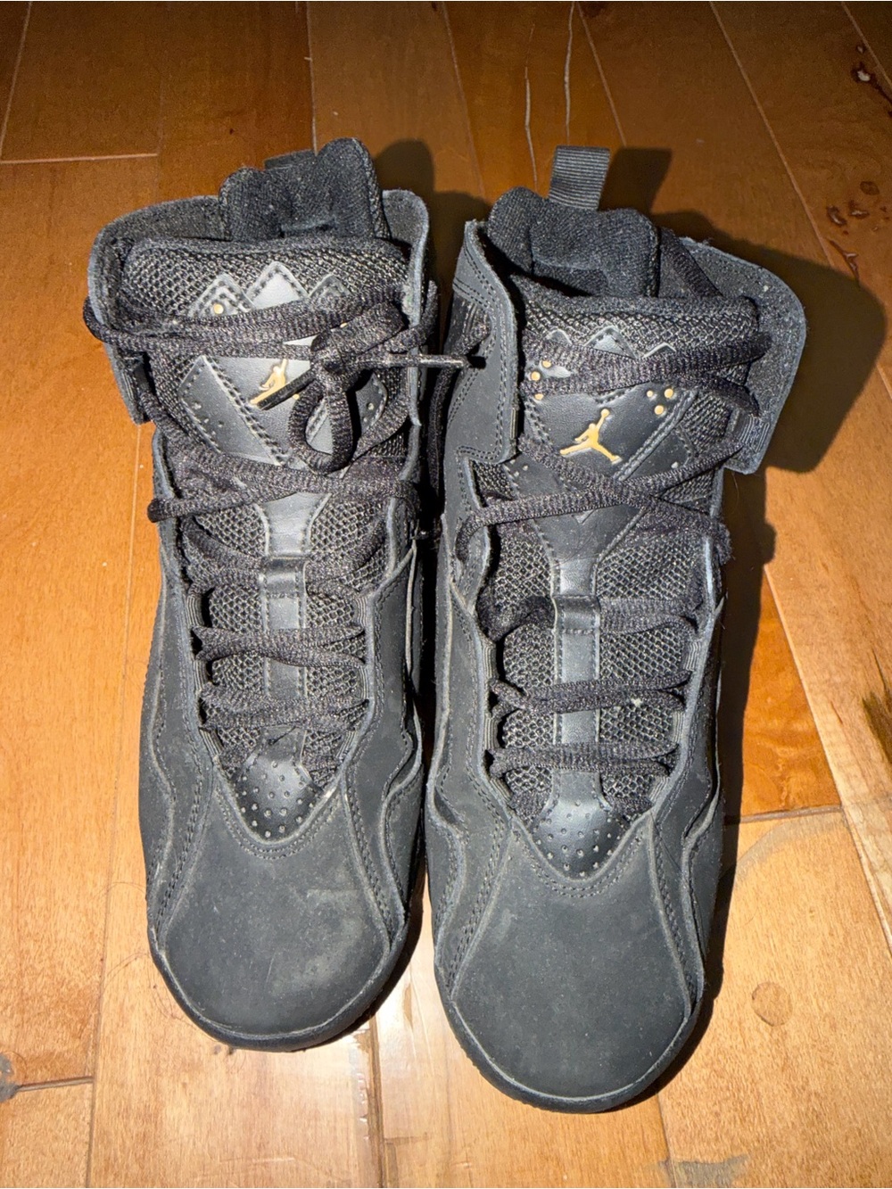 Jordan Men’s Black Sneakers with Gold Jumpman Accents